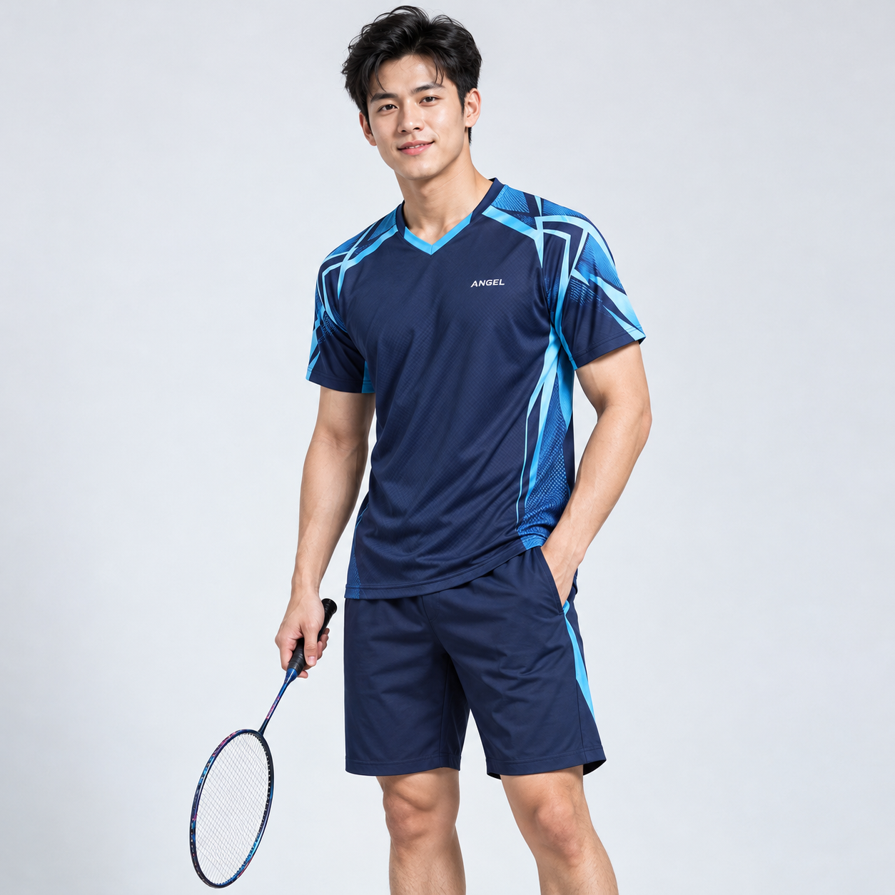 Cầu lông ANGEL Áo cầu lông nam xanh navy phối họa tiết xanh sáng ở vai, kết hợp quần short đồng bộ.